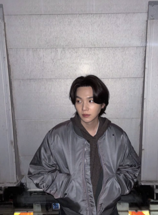 Suga's Steely Gaze Signals BTS Comeback Amid Anticipation
