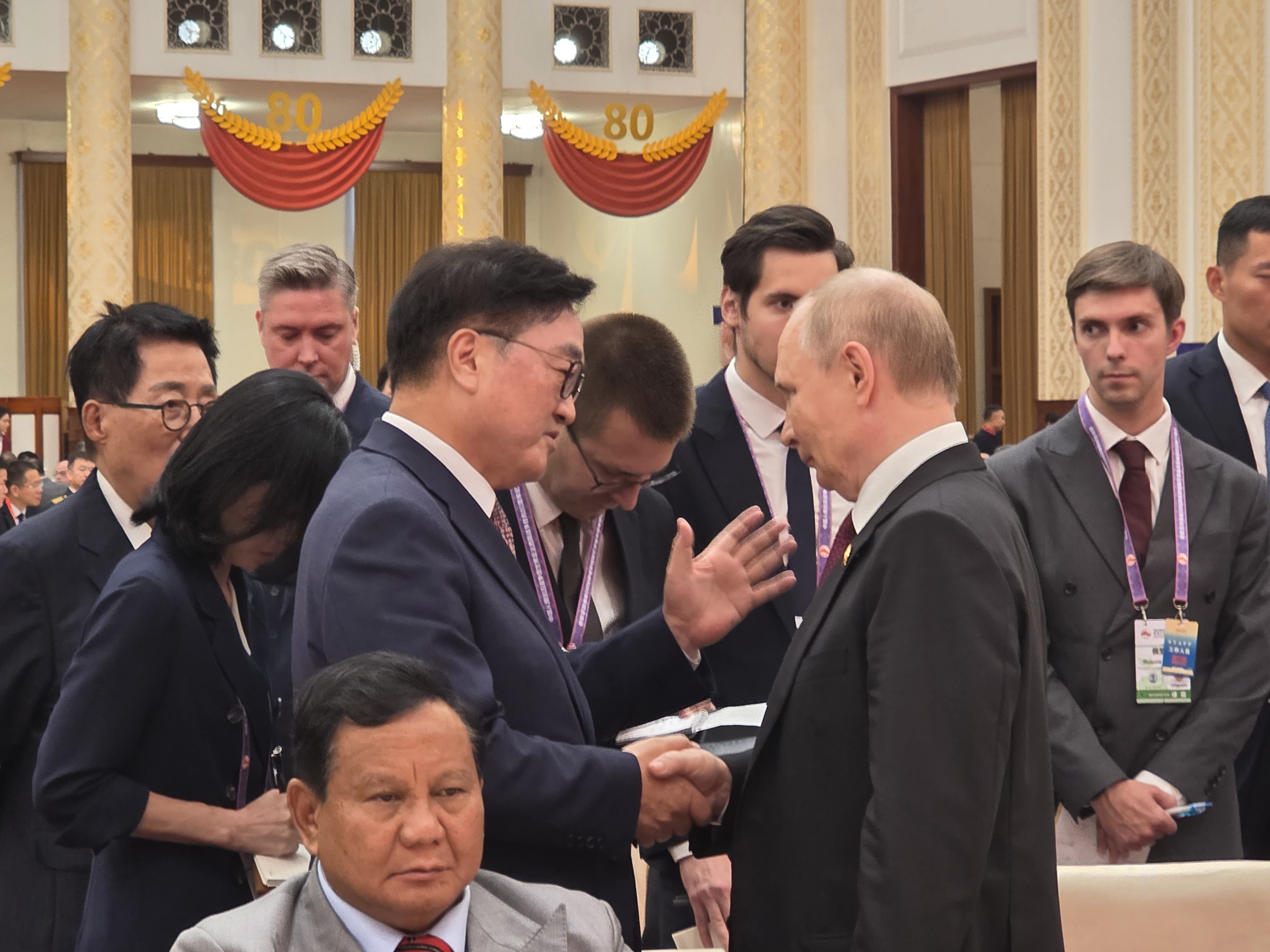South Korean speaker woo shakes hands with kim jong-un